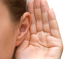 Hand up to ear in "listening" gesture